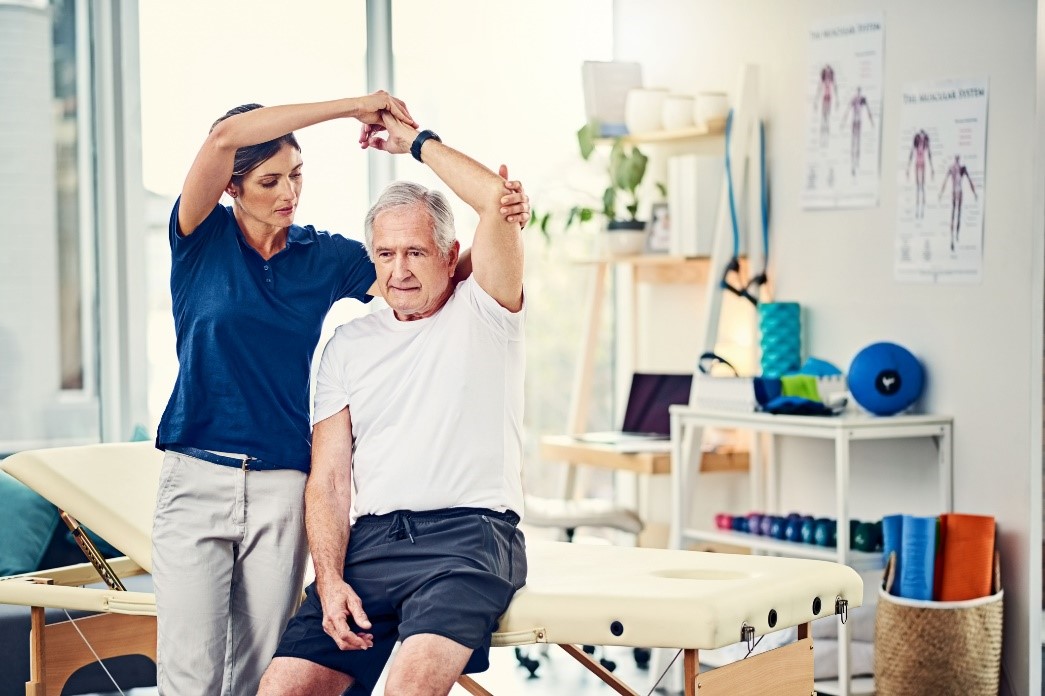 assisting the elderly while stretching